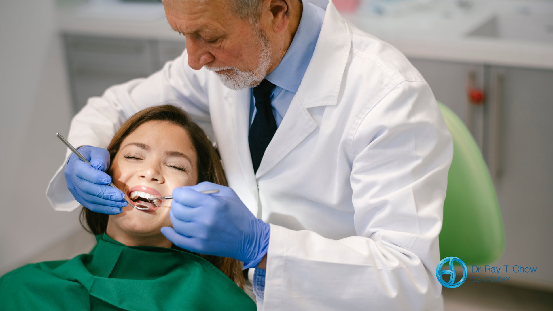 Dentist examining a child’s teeth with gloved hands in a clinic