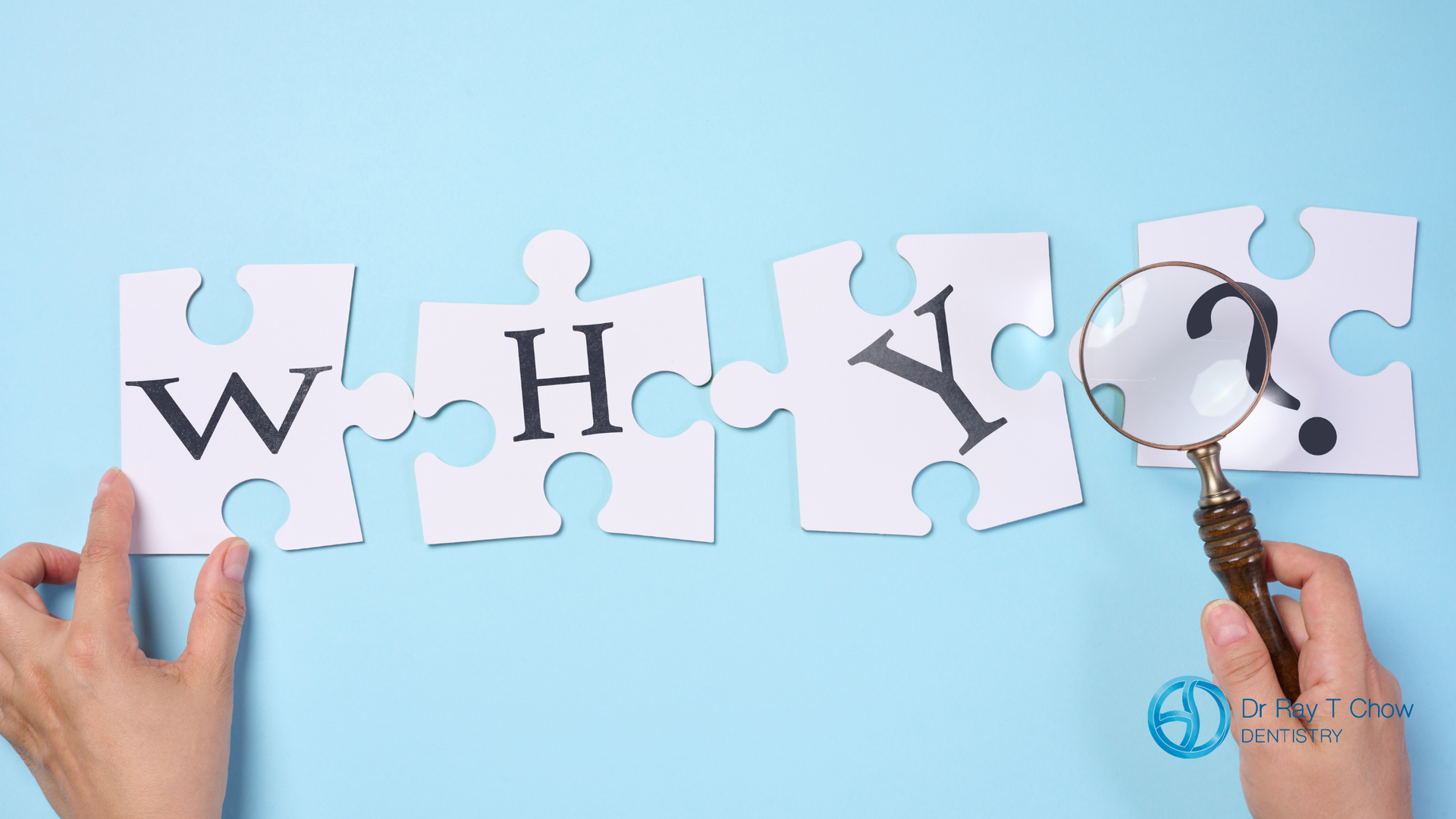 Hands arranging puzzle pieces spelling “WHY?” with a magnifying glass on a blue background.