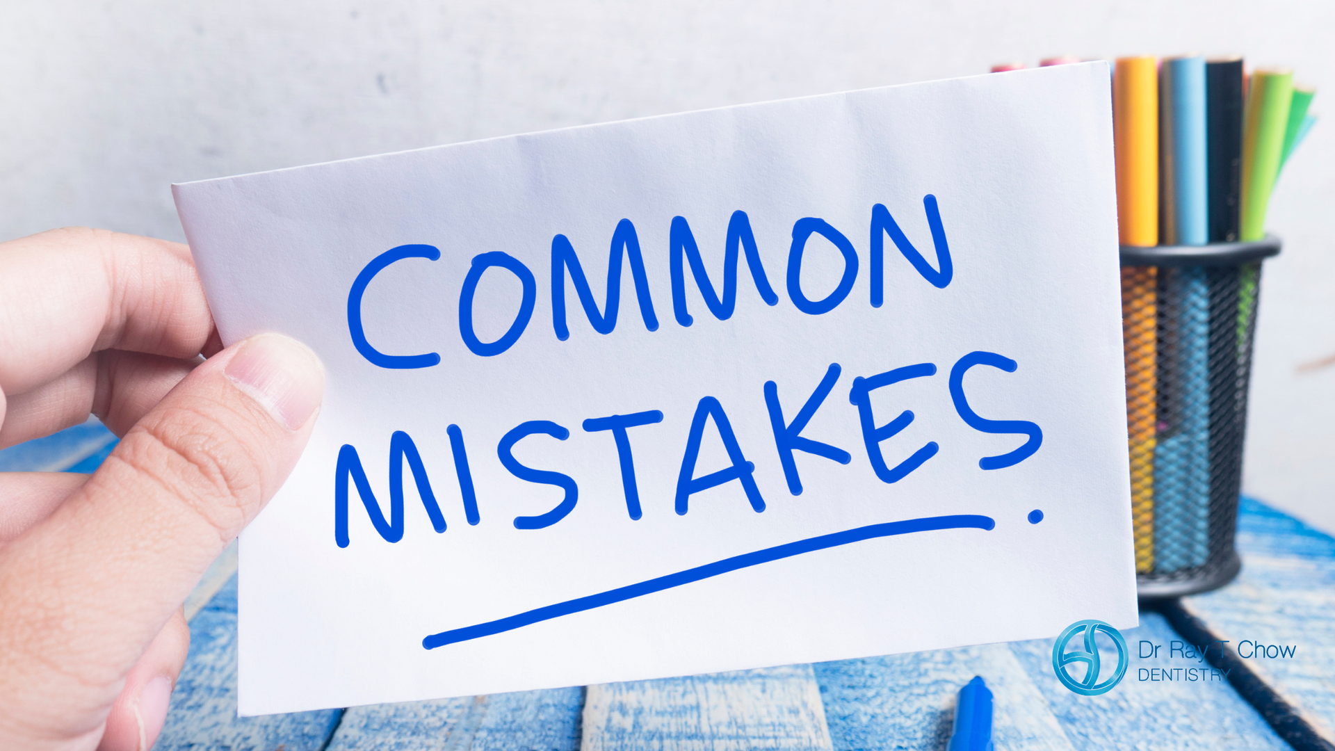 Hand holding a paper that reads