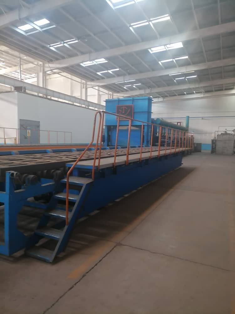 Factory interior with machinery and control panels labeled in Chinese.