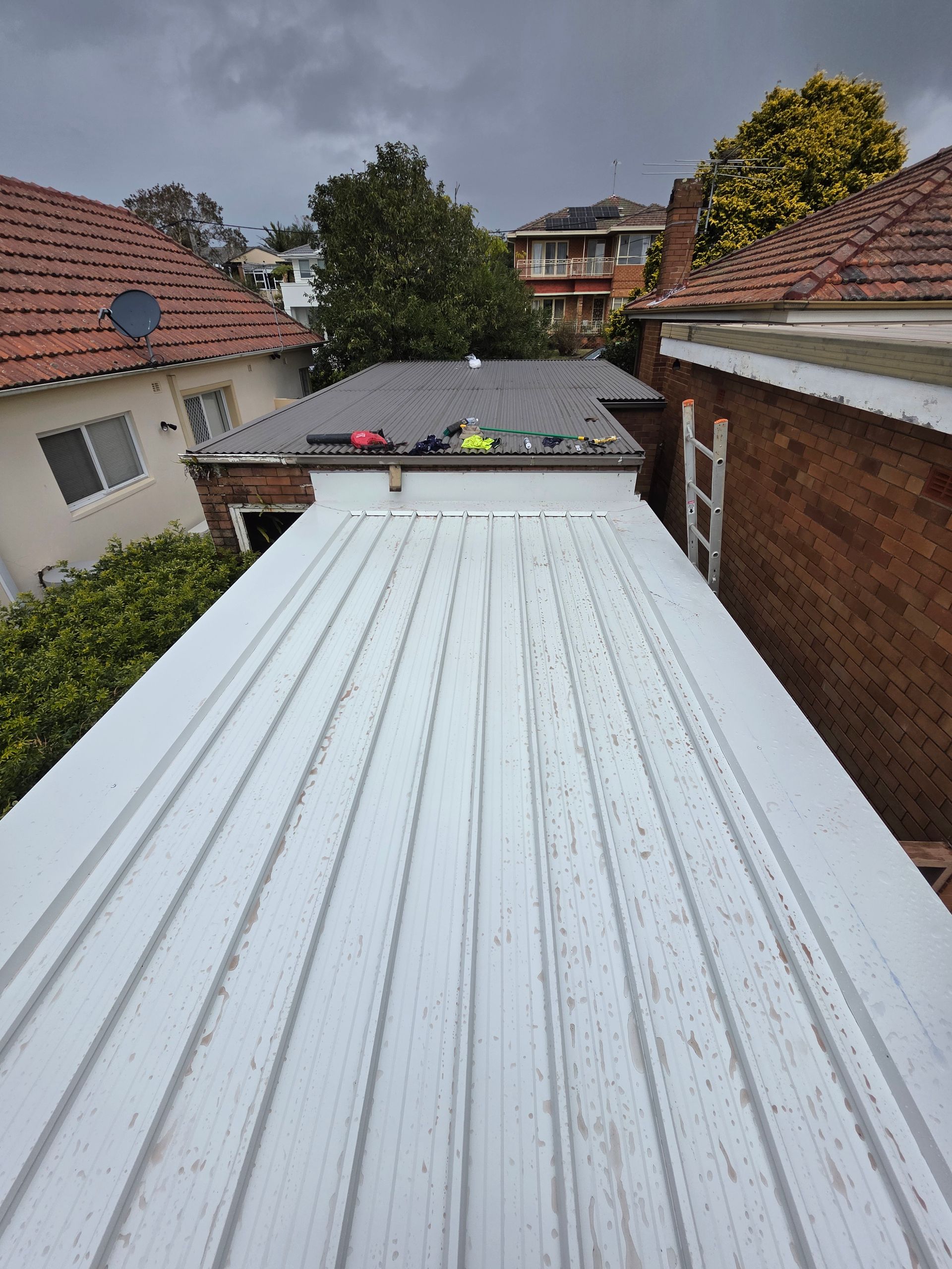 White Corrugated Roof Extending — McLuckie Metal Roofing In Lugarno, NSW