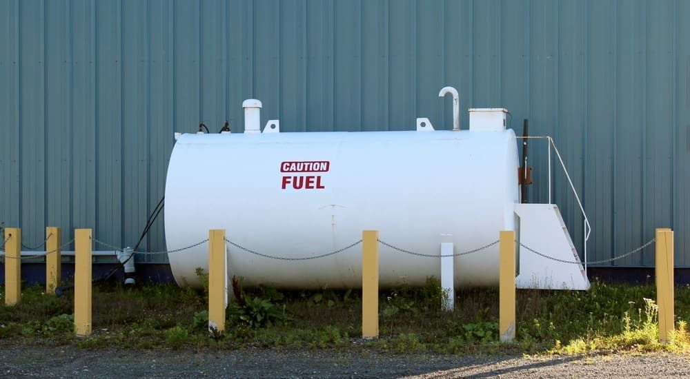 A Large White Tank With The Word Fuel On It — Tyrepower Innisfail In Goondi Bend, QLD