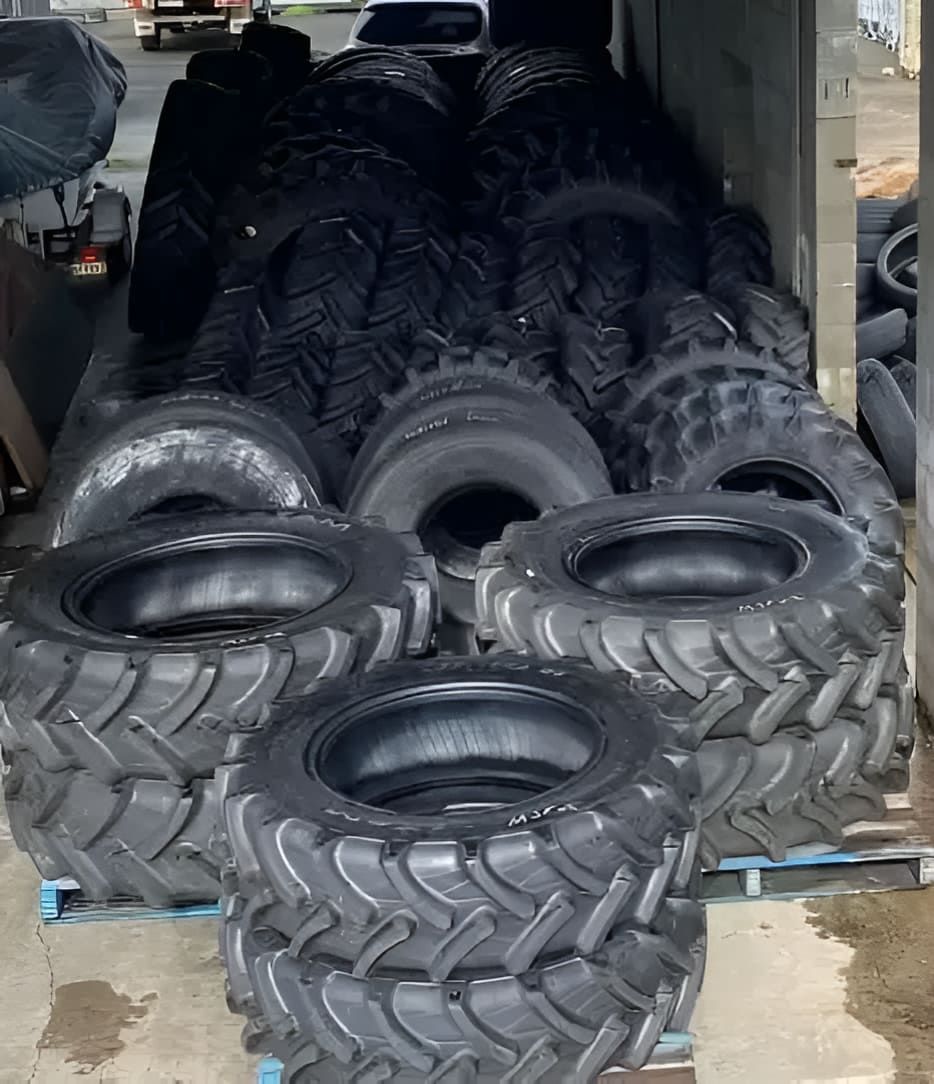 A Bunch Of Tyres Are Stacked On Top Of Each Other On A Pallet — Tyrepower Innisfail In Goondi Bend, QLD