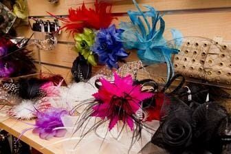 There Are Many Different Types Of Hats And Flowers On The Shelf — Ballistic Chix In Forster, NSW