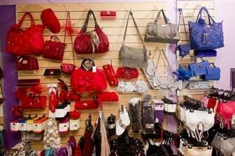 A Wall Filled With Lots Of Handbags And Hats In A Store — Ballistic Chix In Forster, NSW