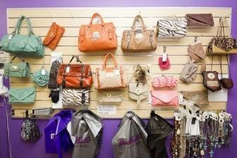 A Wall Filled With Lots Of Handbags And Necklaces — Ballistic Chix In Forster, NSW