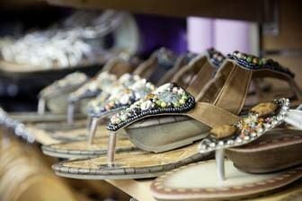 A Row Of Sandals Sitting On Top Of A Wooden Shelf — Ballistic Chix In Forster, NSW