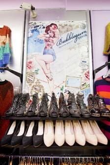 A Display Of Shoes In A Store With A Picture Of A Woman On The Wall — Ballistic Chix In Forster, NSW