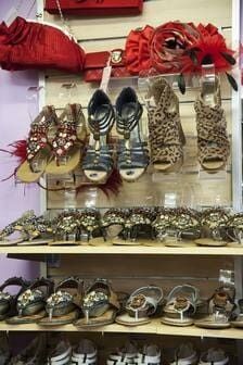 A Shelf Filled With Lots Of Shoes And Handbags In A Store — Ballistic Chix In Forster, NSW