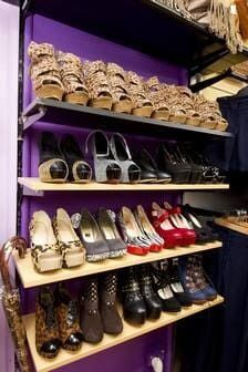 A Shelf Filled With Lots Of Shoes On A Purple Wall — Ballistic Chix In Forster, NSW