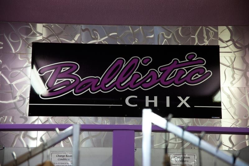 A Sign For Ballistic Chix Hangs On A Purple Wall — Ballistic Chix In Forster, NSW