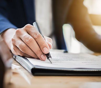 Attorney Writing on Form — Mobile, AL — Green Disability Law
