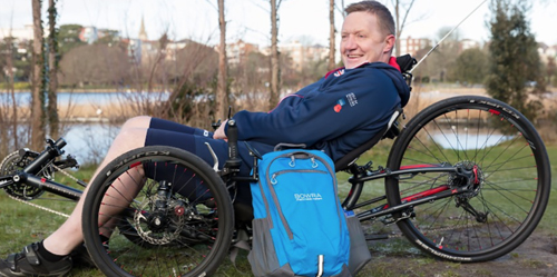 Man sat in adaptive bike with Bowra Bag for which Cheryl Lawes is a Trustee