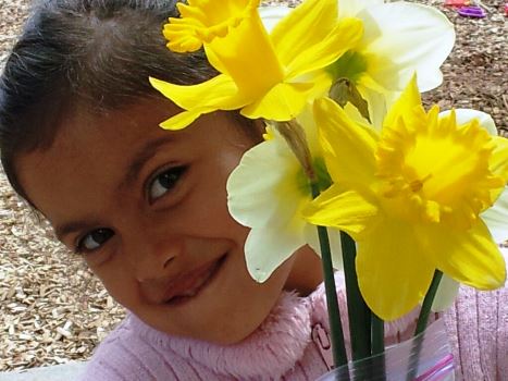 Physical Development — Female Kid with Flower in Cameron Park, CA