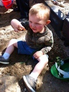 Creative Development — Child Sitting on Soil in Cameron Park, CA