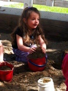 Preschool Placerville — Female Child with a Bucket of Soil in Cameron Park, CA