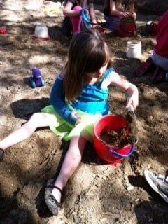 Preschool Child Care — Female Child Collecting Soil in Cameron Park, CA