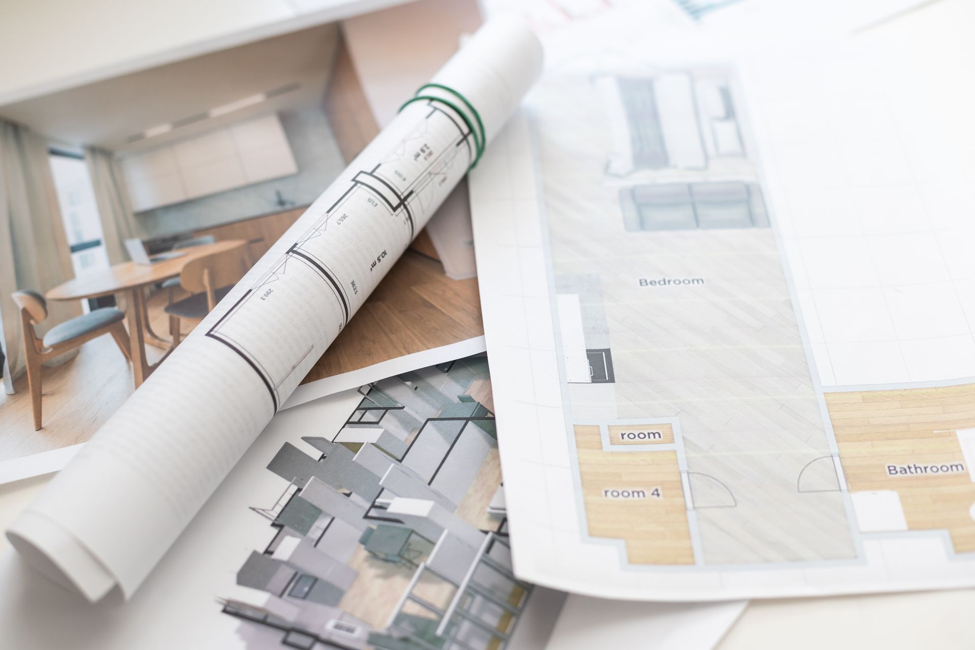 Architectural plans & detailed drawings spread out on a table, showcasing design elements & layout. Architectural plans & detailed drawings spread out on a table, showcasing design elements & layout.