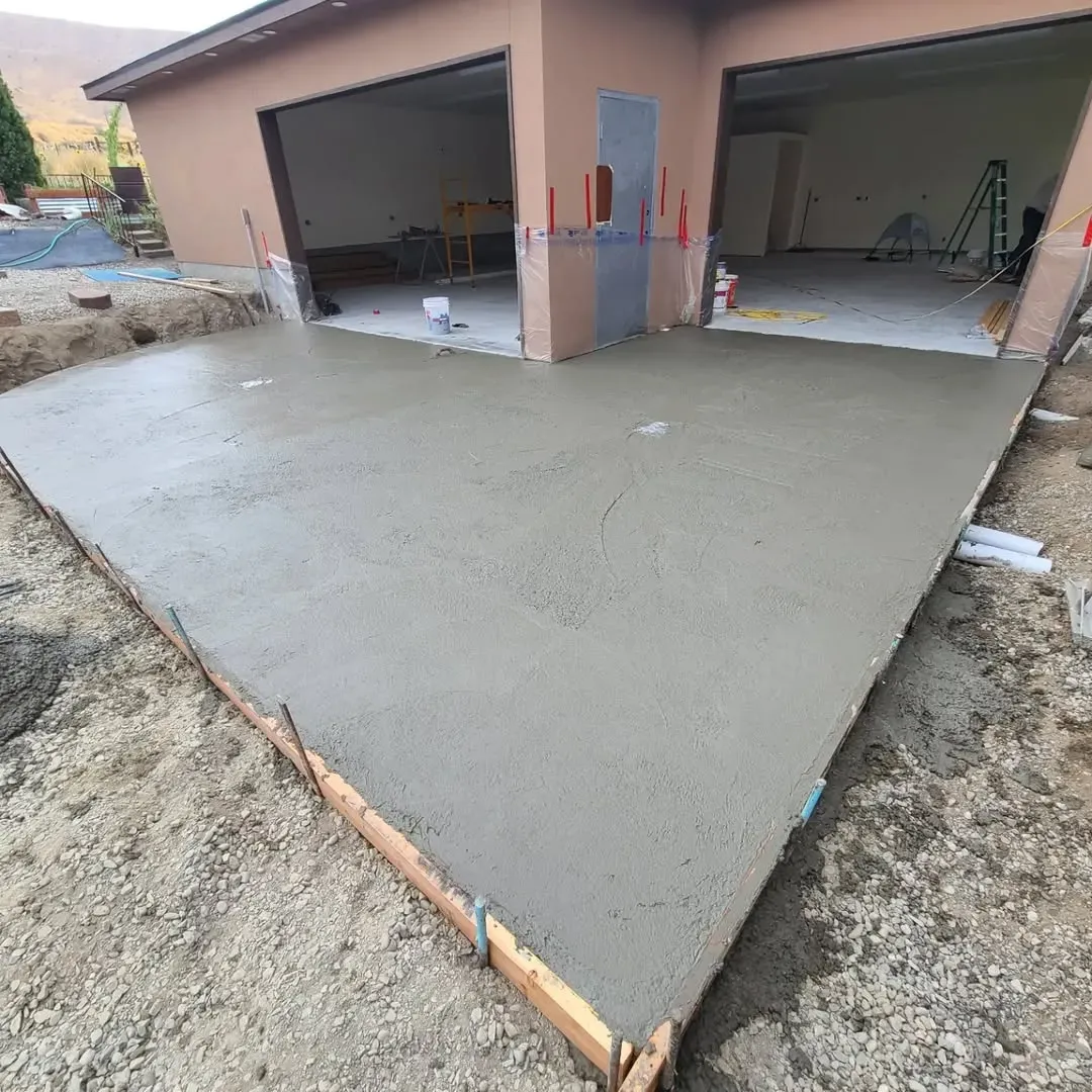 Waypoint Concrete poured a residential broom-finish concrete driveway with gravel trim in Meridian, Idaho.