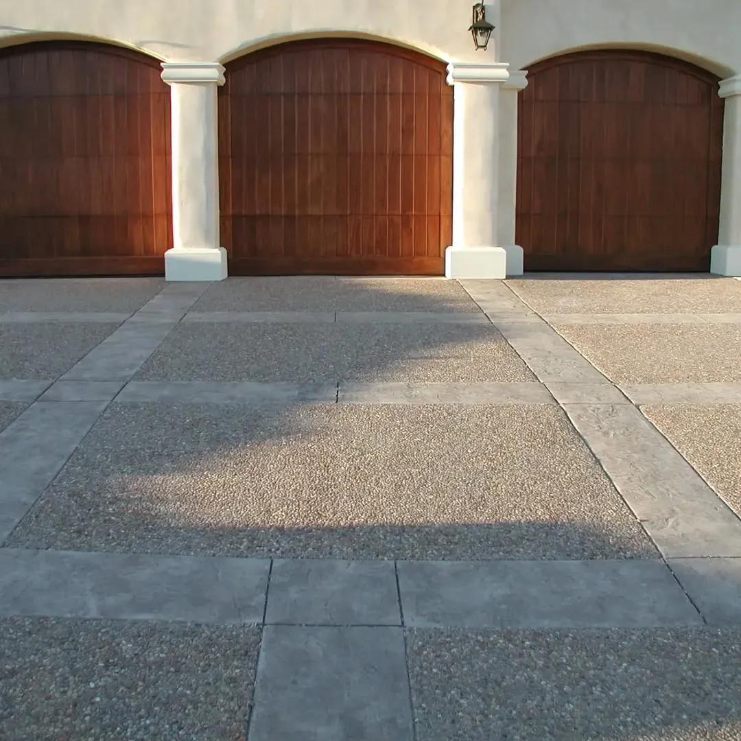 Decorative concrete driveway in front of residential garage in San Diego.