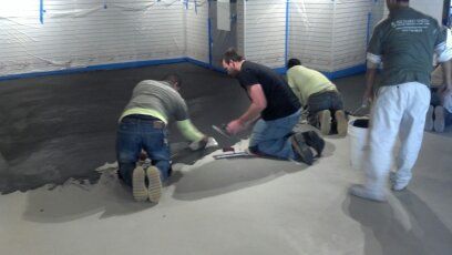 Crew installing concrete flooring in San Diego.