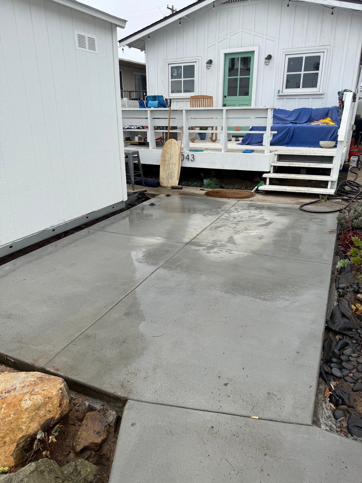 Newly built round concrete patio beside a home in San Diego.