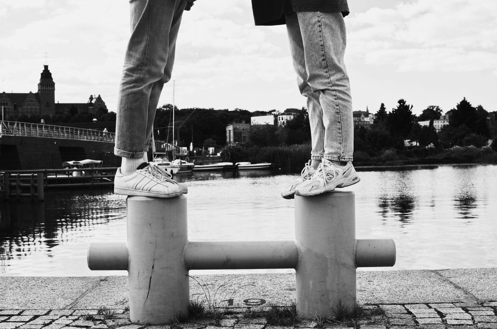 A black and white photo of two people standing next to each other