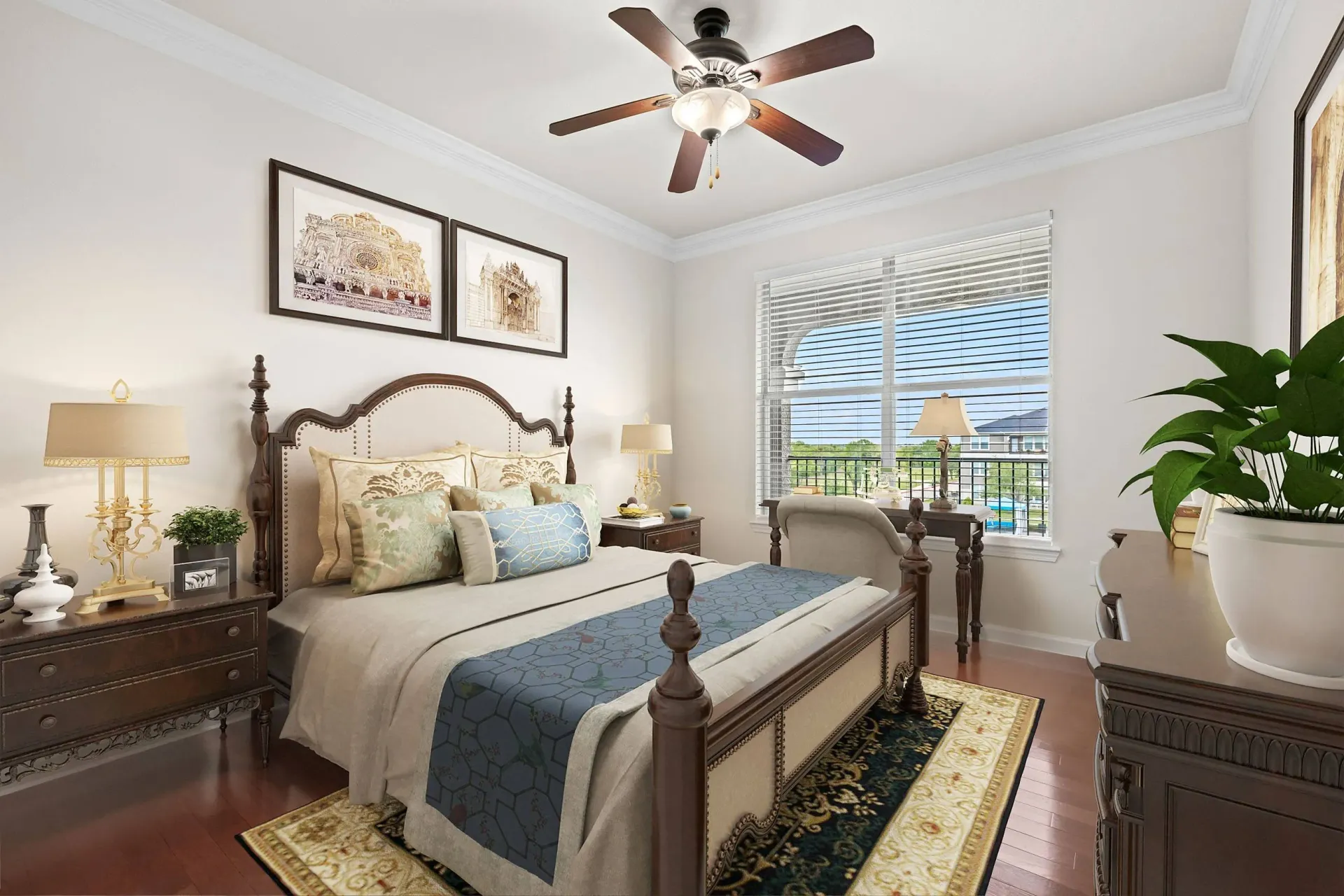 A beautifully staged bedroom with a king-size bed, a ceiling fan, and a desk by the window.