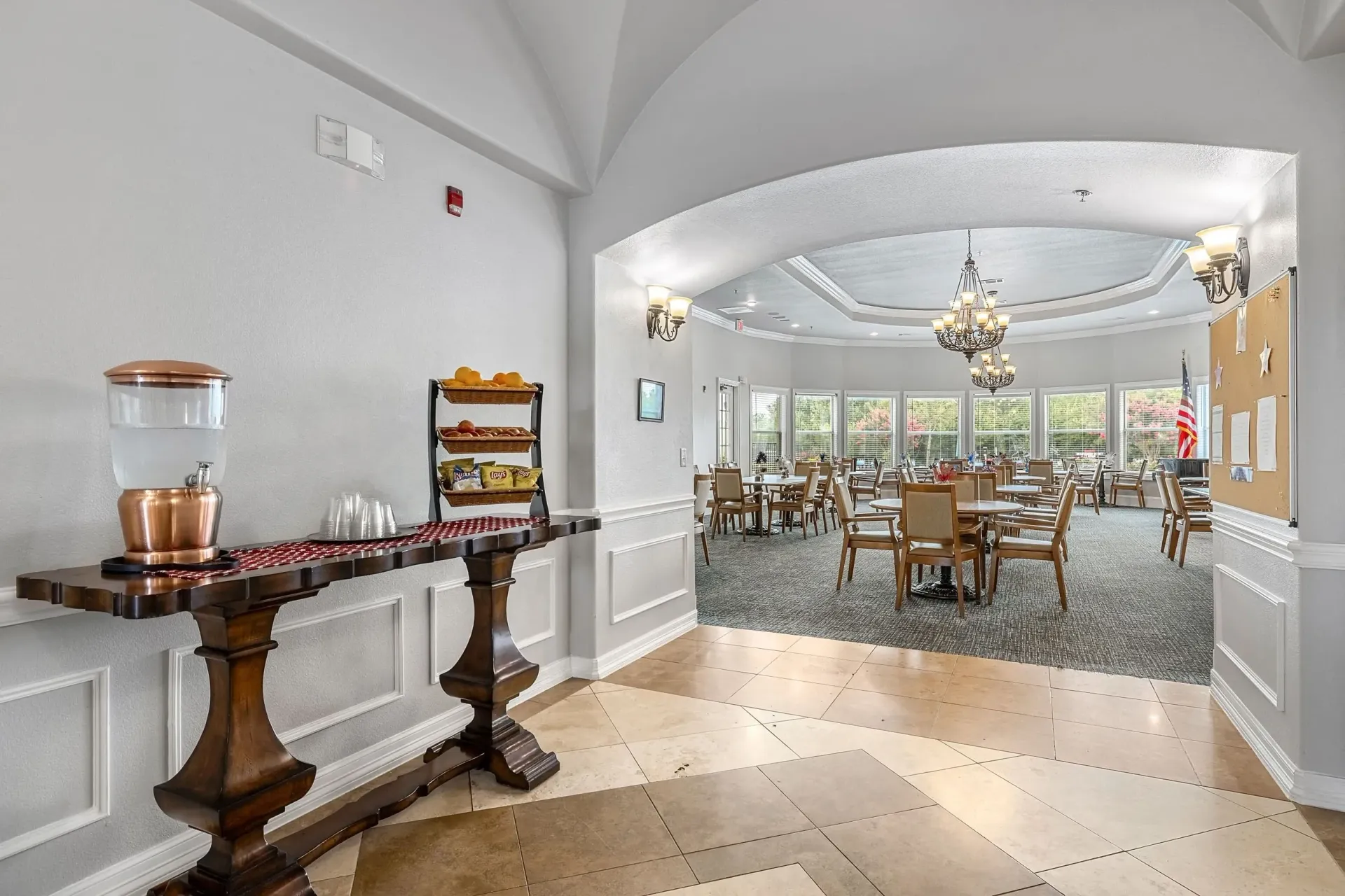 Entrance to dining area with water dispenser and snack station.