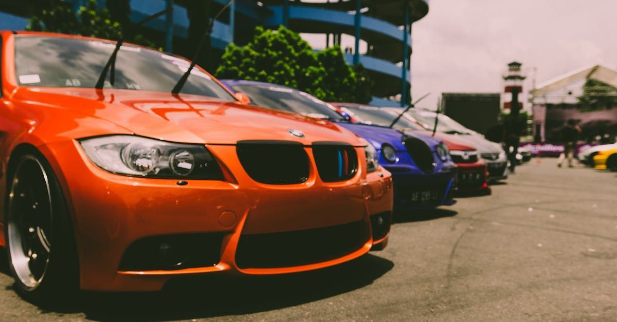 A row of cars are parked in a parking lot.  | Whitaker Auto Repair