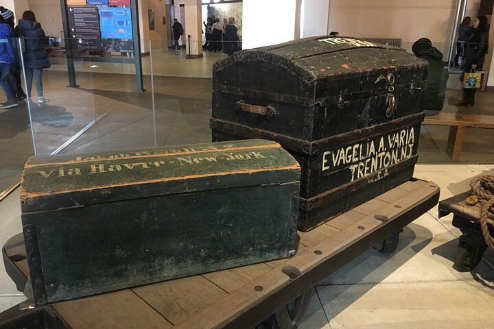 Two weathered trunks with inscriptions, 