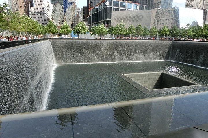 The 9/11 Memorial reflecting pool with cascading water, New York City.