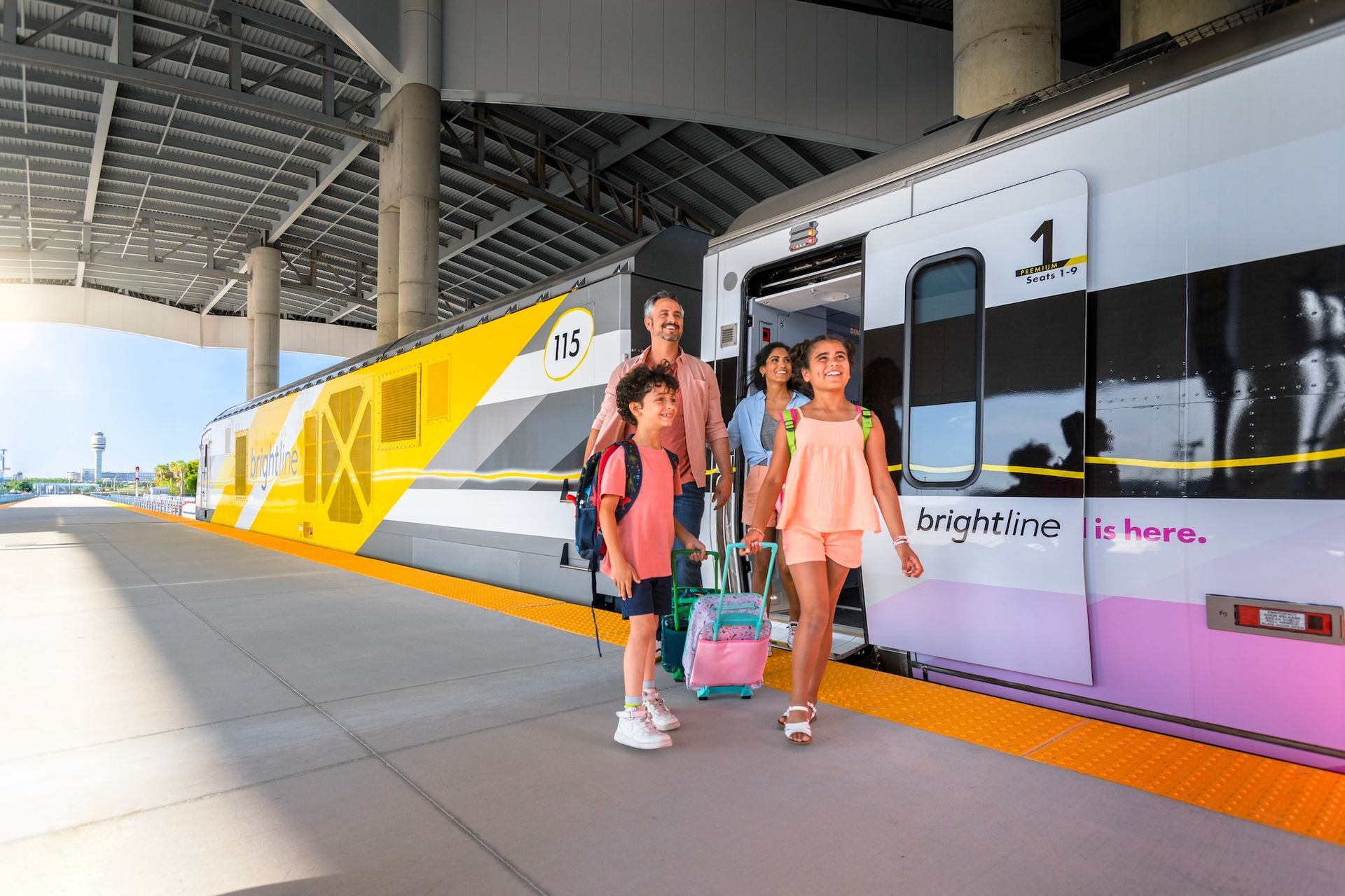 Family exiting a Brightline train at a sunny station. Bright yellow and pink colors.