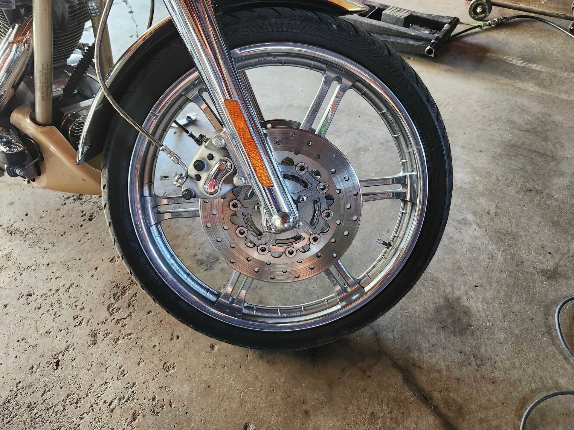 A close up of the front wheel of a motorcycle