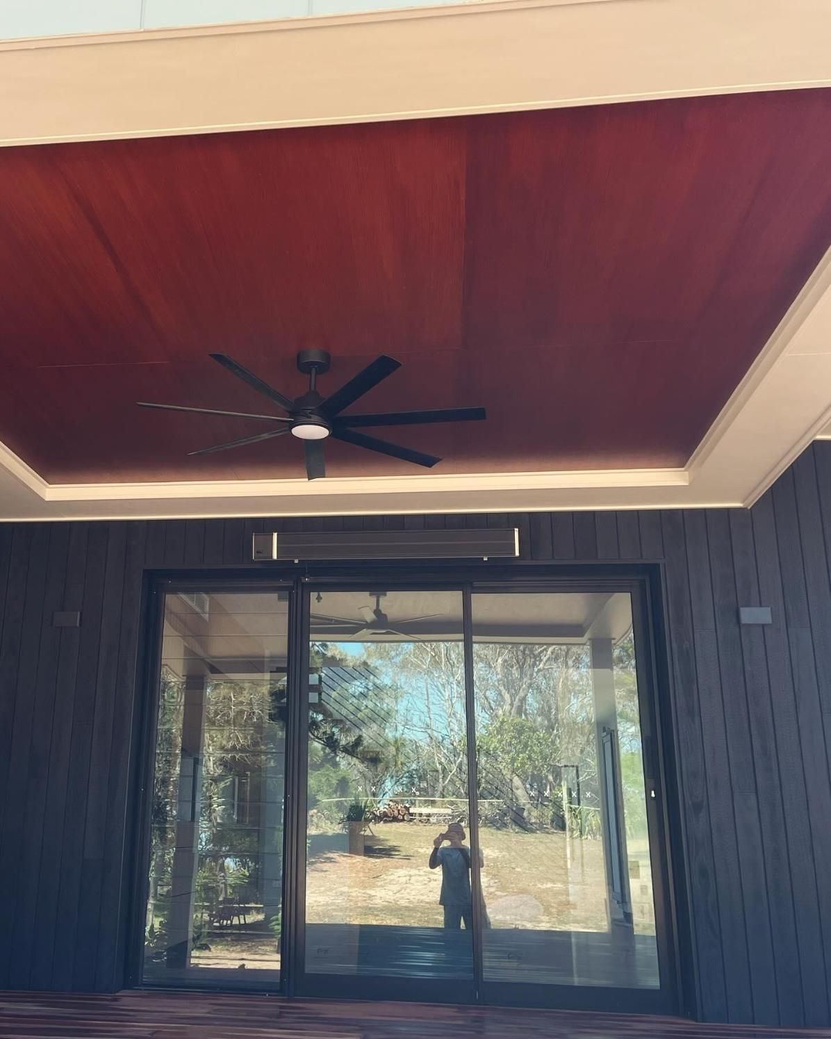 A Ceiling Fan is Above a Sliding Glass Door — Holster Painting Contractors In Port Macquarie, NSW