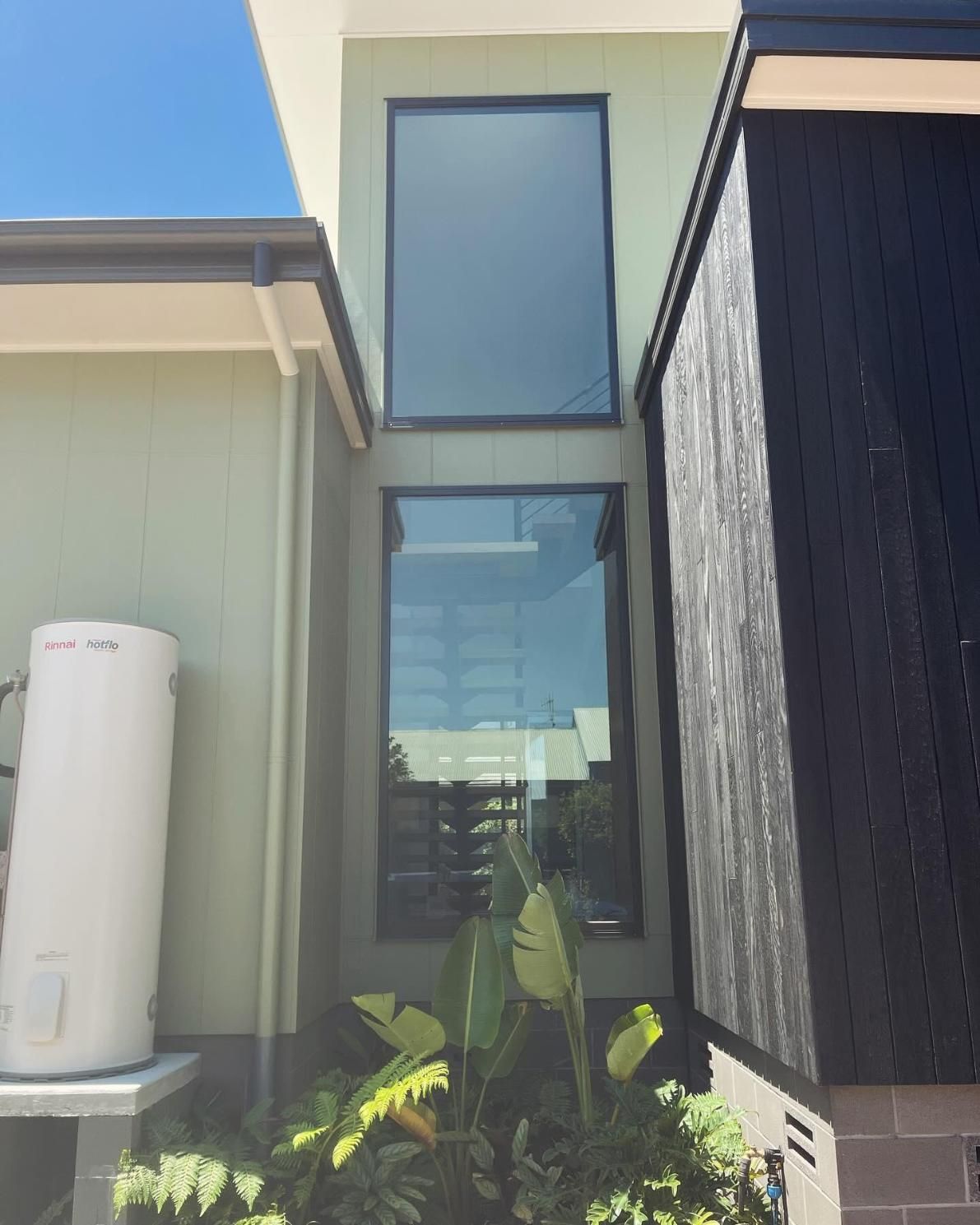 A House With a Large Window and a Water Heater on the Side — Holster Painting Contractors In Port Macquarie, NSW