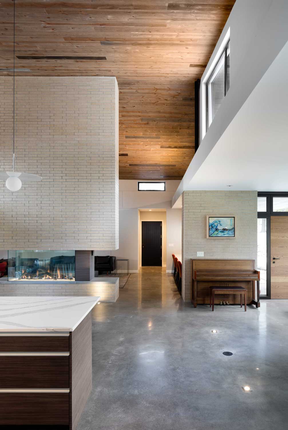 Modern home interior finishes with natural wood ceiling and skylight