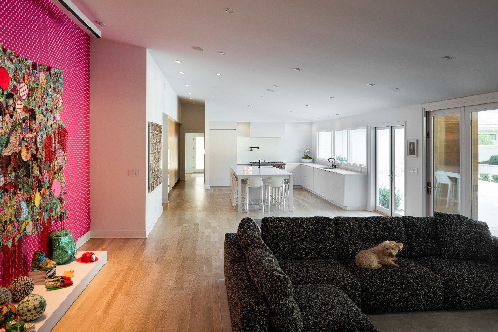 Modern, open living room with view of kitchen