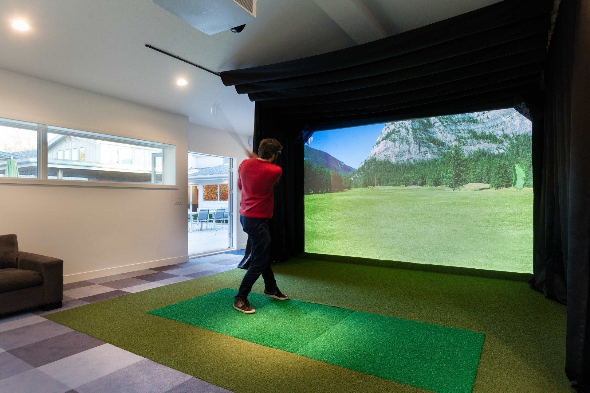 Man using golf simulator