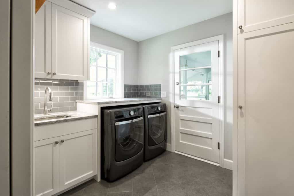 Off kitchen laundry room with side by side washer and dryer