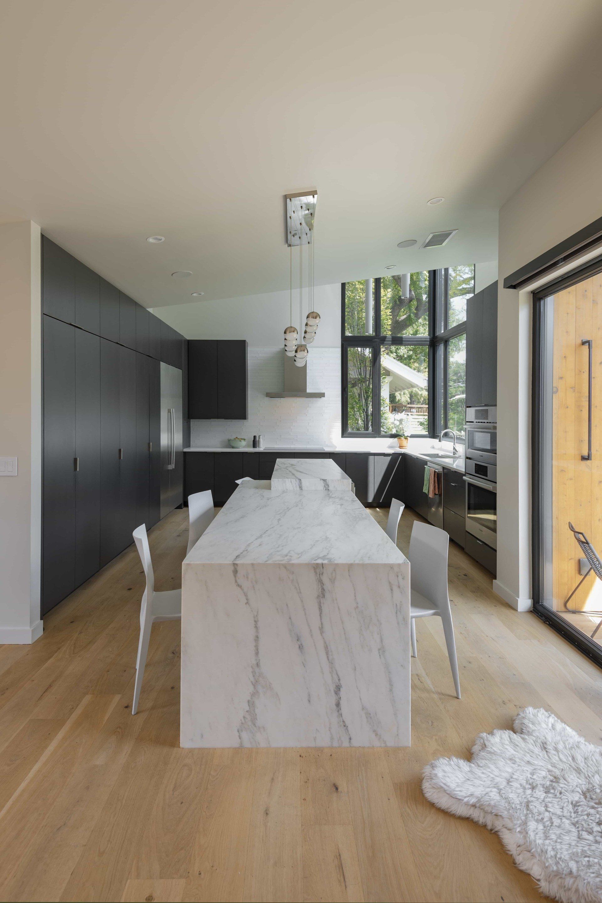 Straight on view of stone kitchen island in a modern kitchen