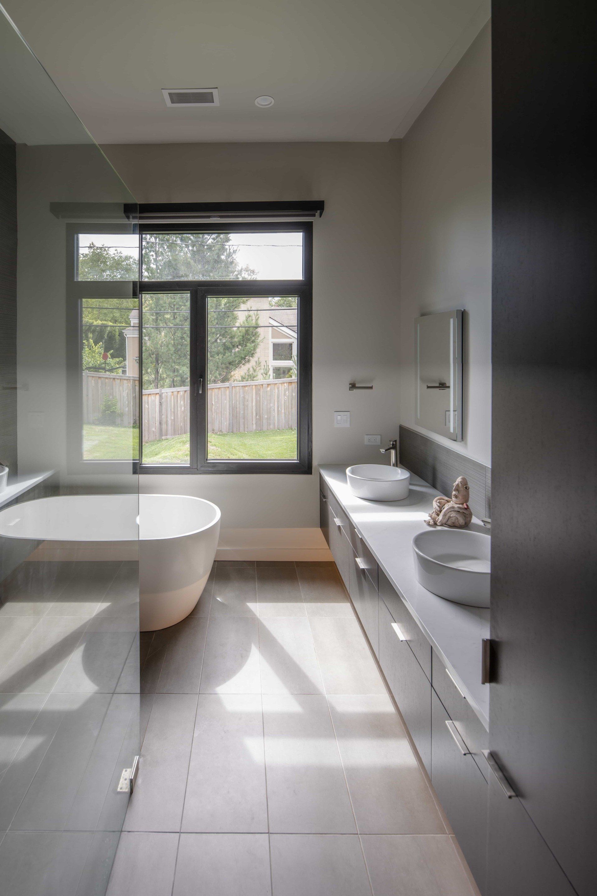 Modern bathroom with large bathtub and glass shower