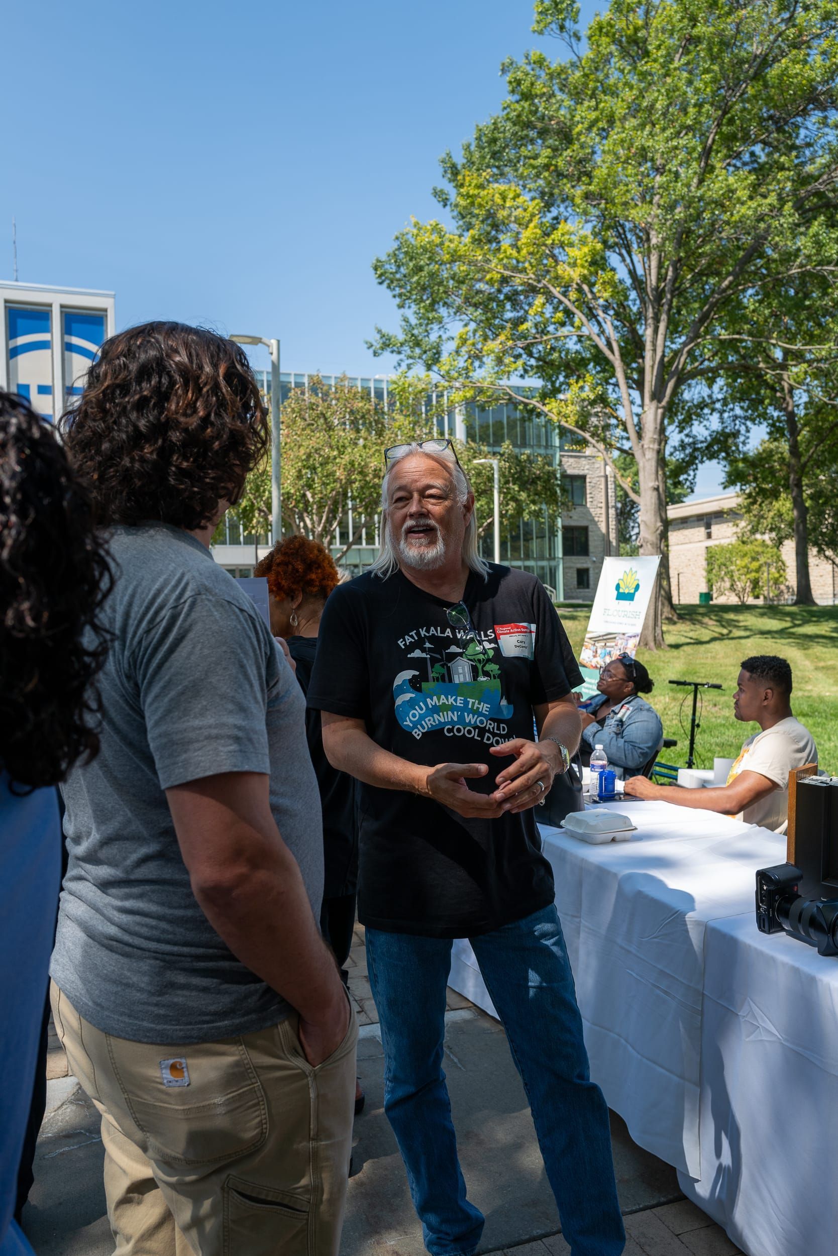 Cary DeCamp talking to an attendee