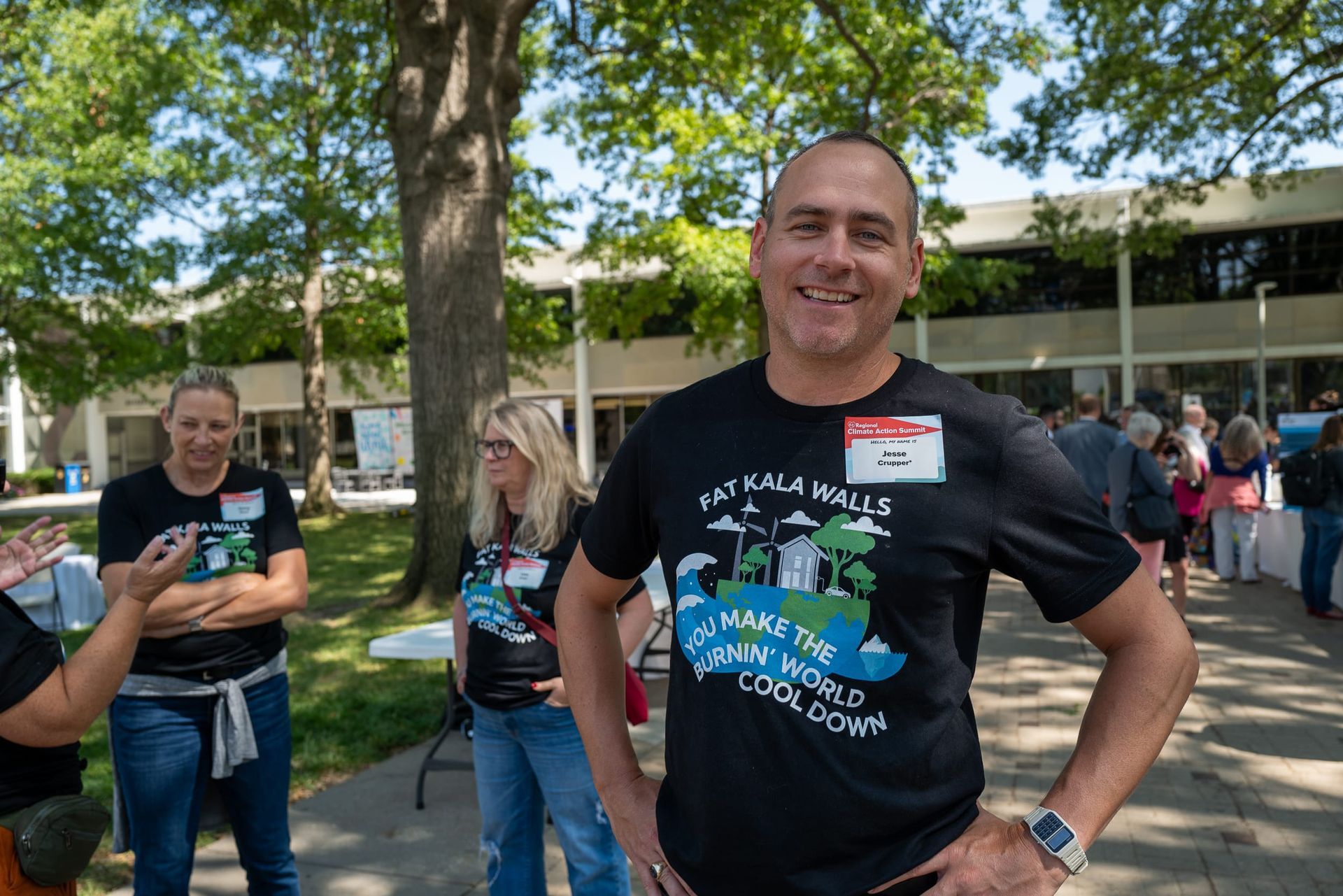 Jesse Crupper smiling while wearing a Kala shirt at the Climate Action Expo
