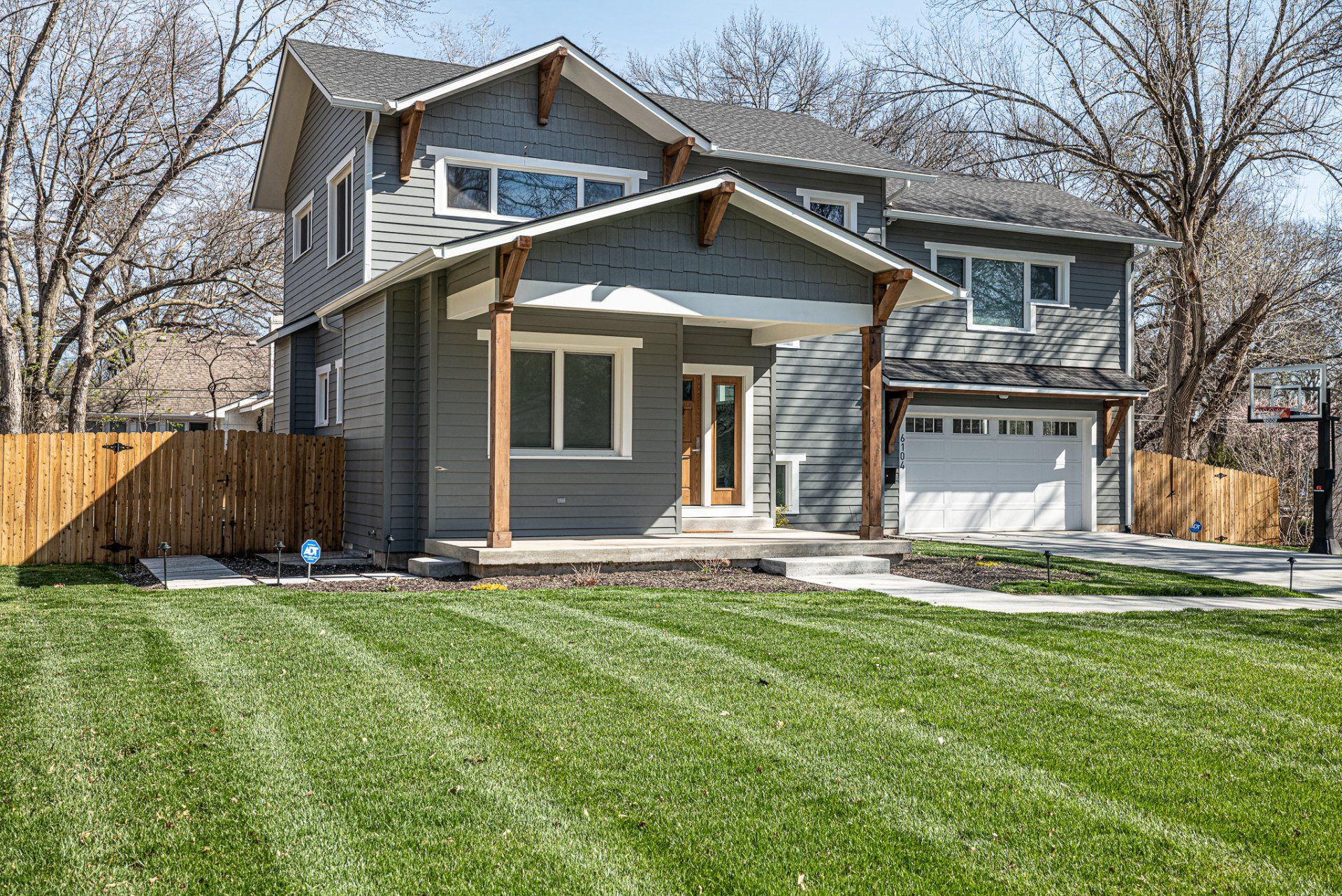 Modern suburban house with freshly cut grass.