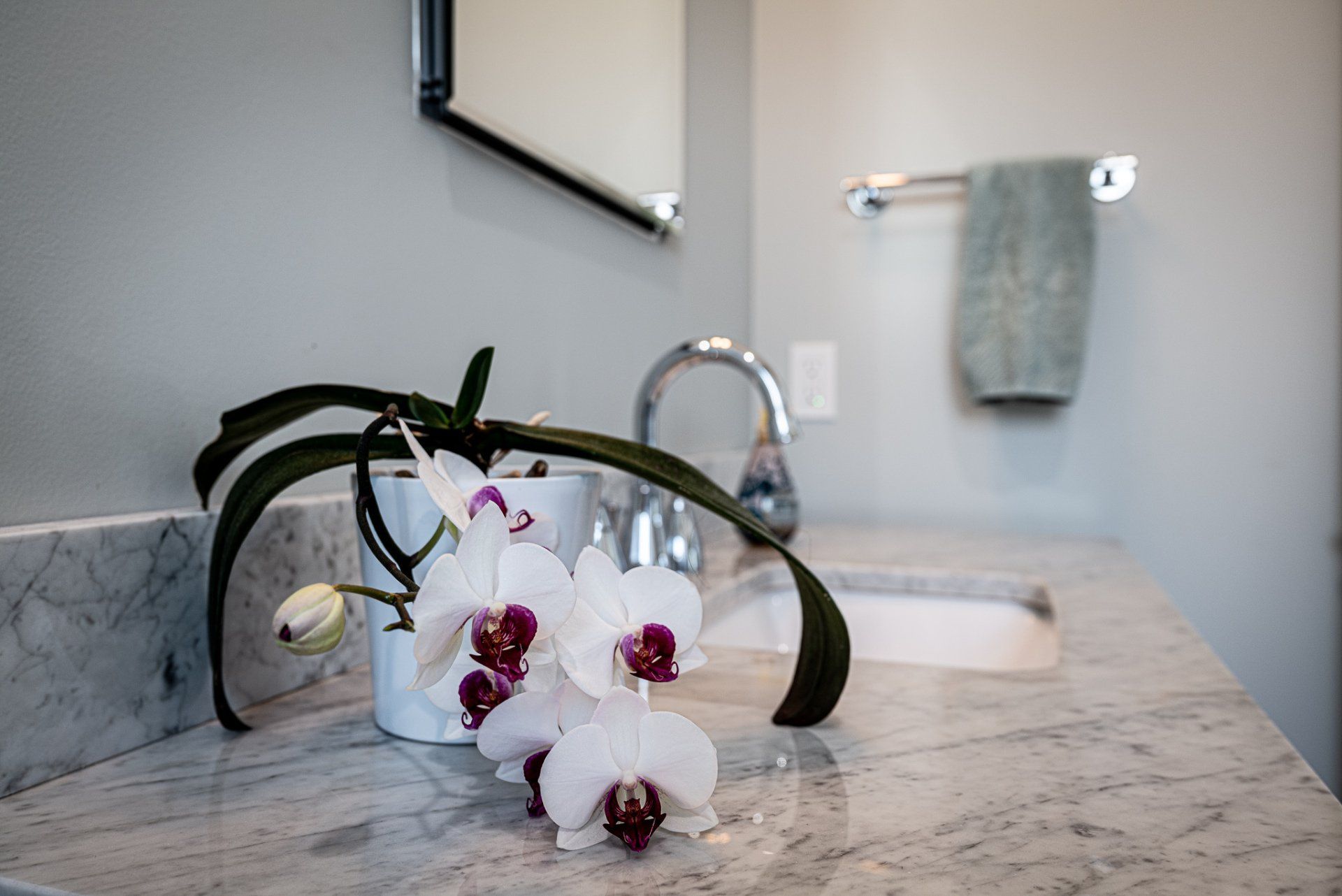 Bathroom counter with floral decoration.
