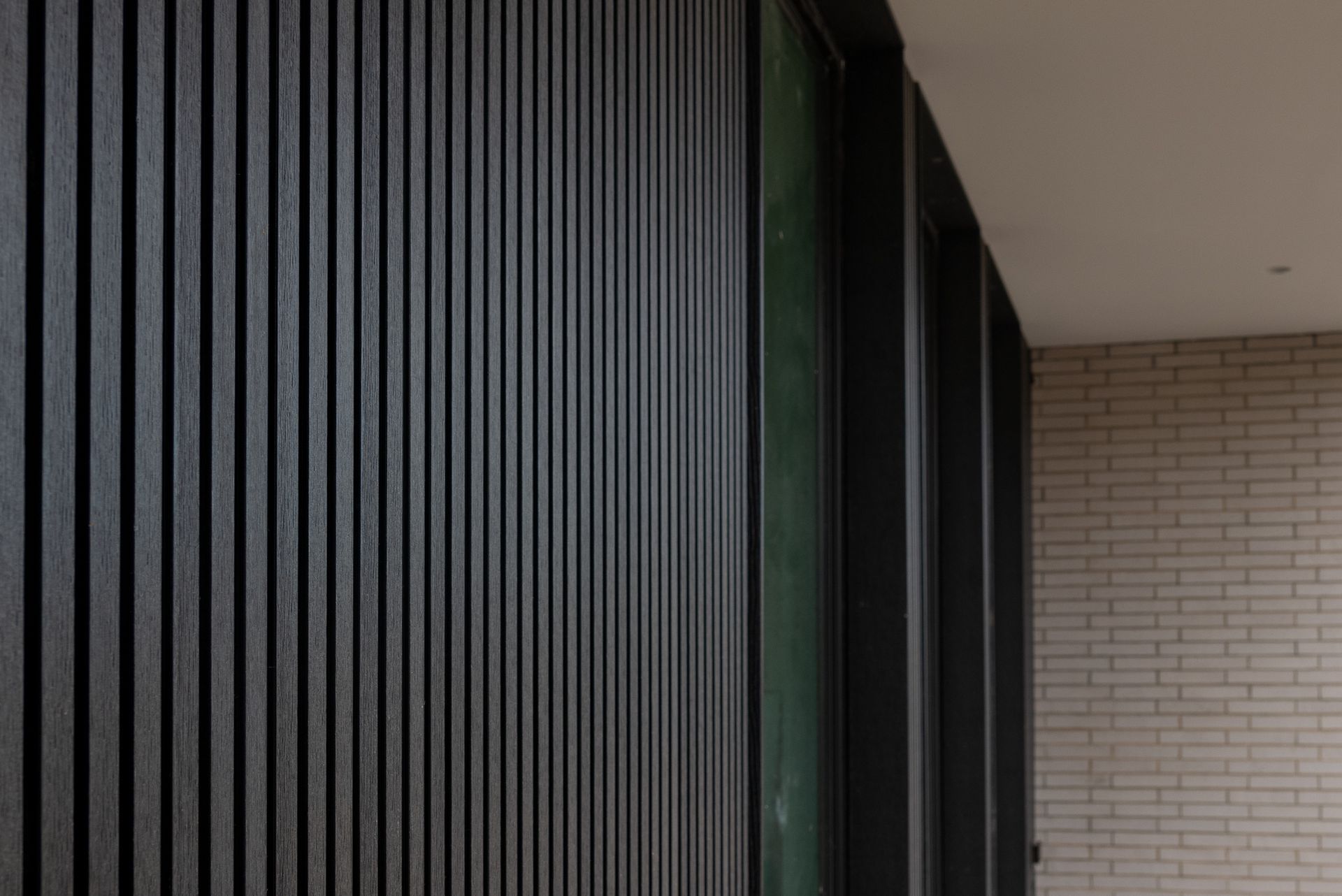 Vertical siding in the entry way of a Prairie Village home