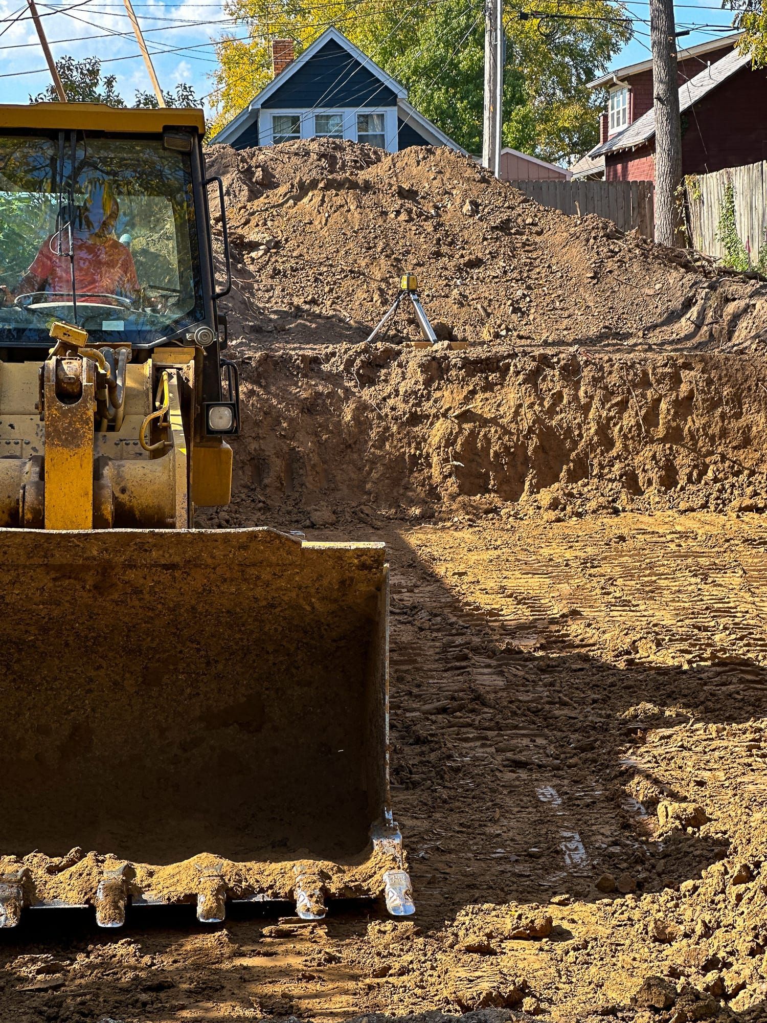 A bulldozer is moving dirt on a construction site.