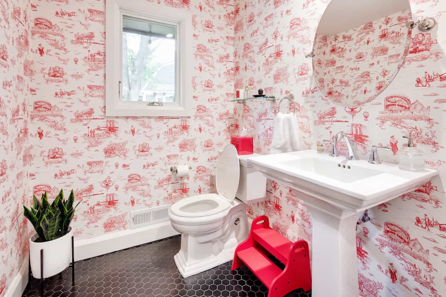 Powder room with colorful pink wallpaper