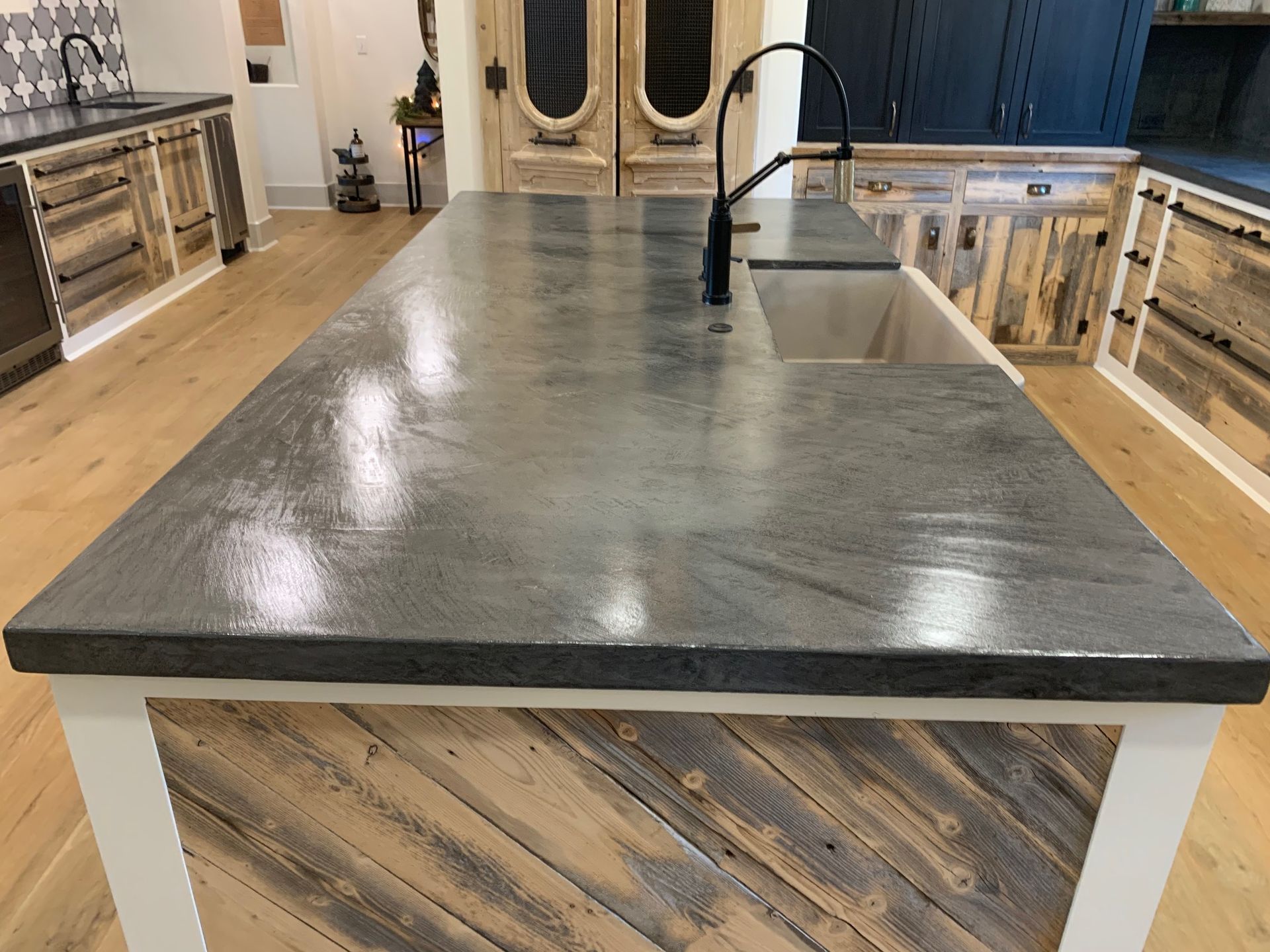 A kitchen with a large island and a sink